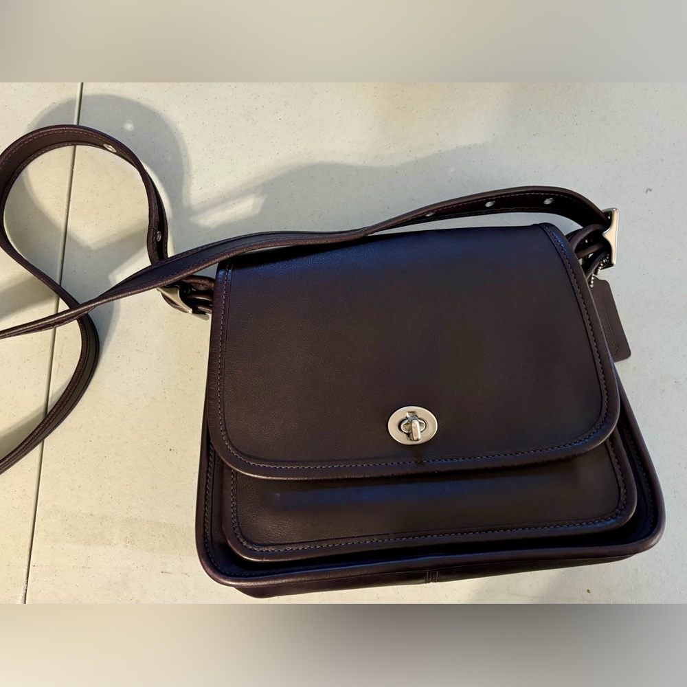 Coach Legacy Rambler in deep Eggplant color with Nickle hardware.